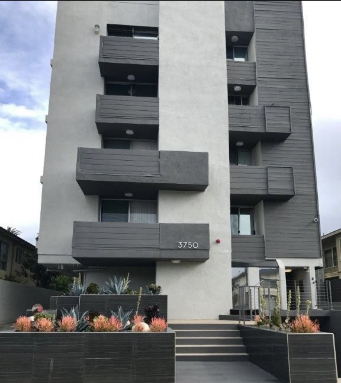 Contemporary mid-rise residential building managed by Aura Property Co. in California